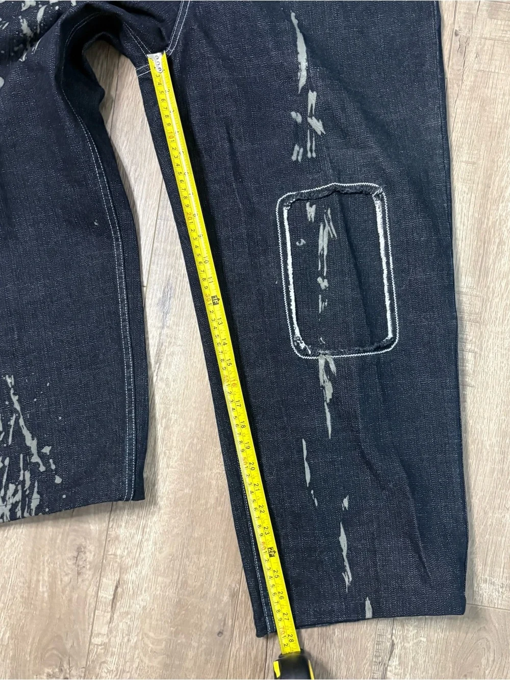 These wide-leg black jeans with white paint splatters Size 36x28